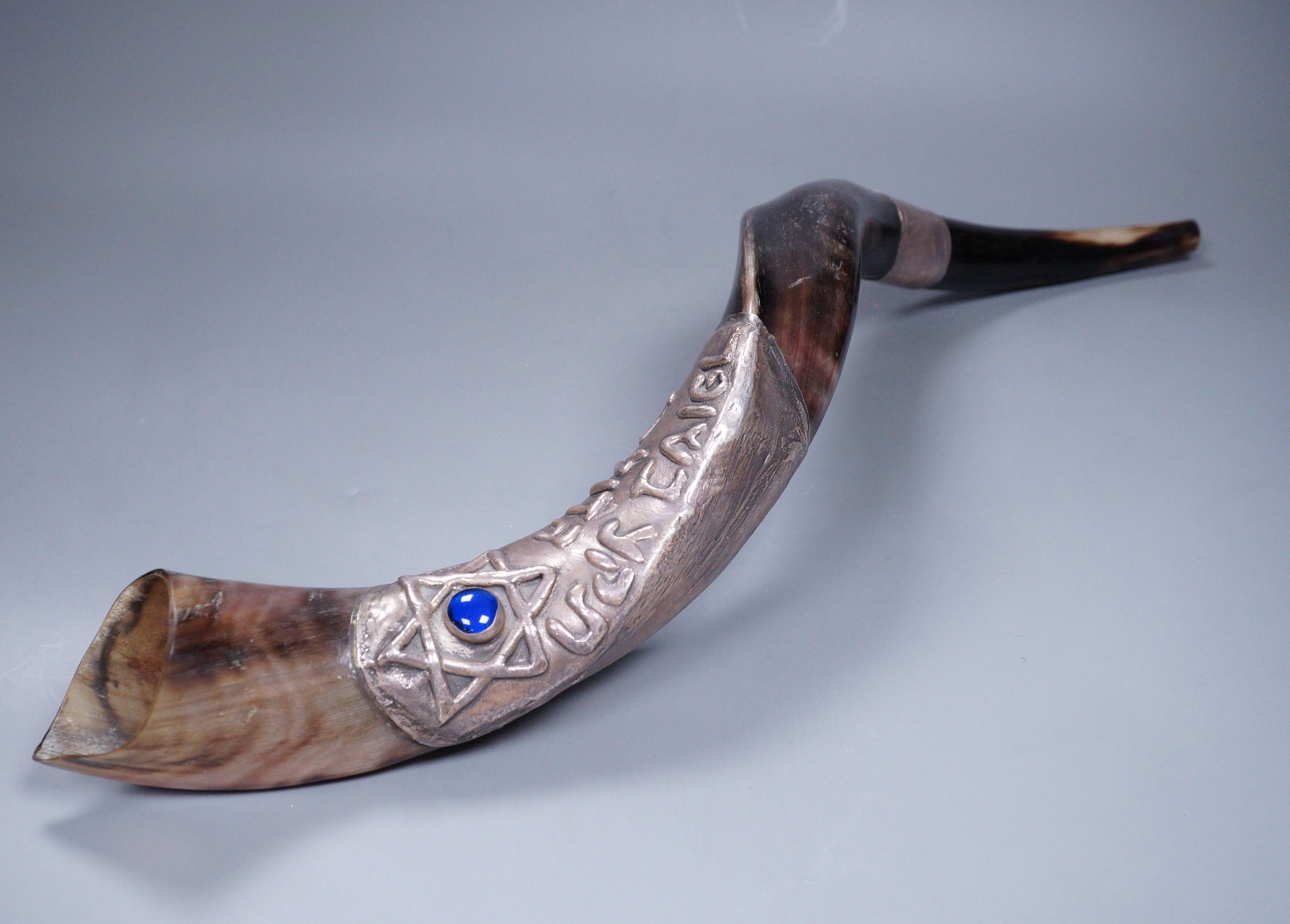 An Israeli white metal mounted horn shofar, stamped 925, 59cm